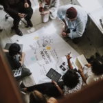 UK marketing experts collaborating on performance data to boost online sales for local businesses